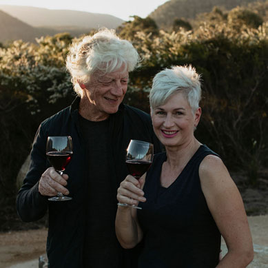 Lynne and Paul with glass of wine