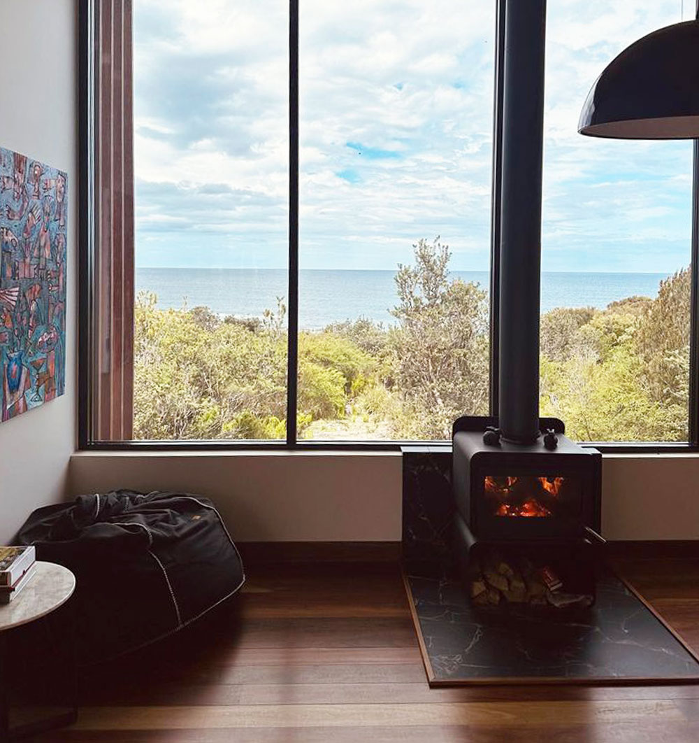 Fireplace with floor to ceiling windows